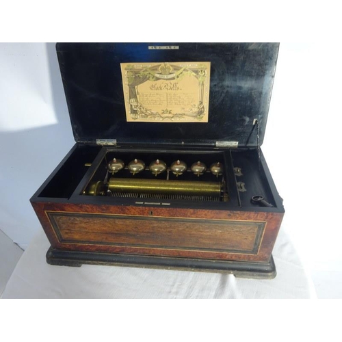 52 - A large Victorian inlaid rosewood cased Swiss music box. (12 tunes) not working. One tooth missing. ... 