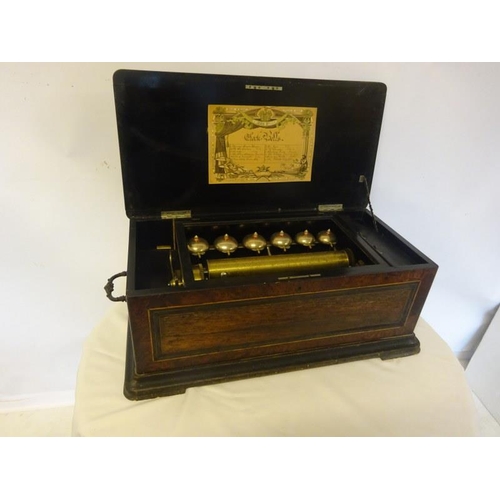 52 - A large Victorian inlaid rosewood cased Swiss music box. (12 tunes) not working. One tooth missing. ... 