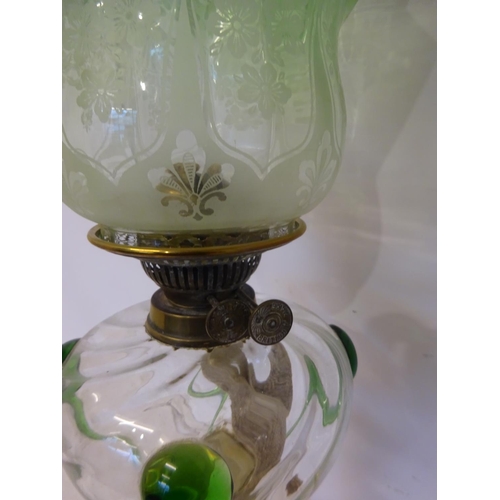 61 - Antique brass and copper column oil lamp having clear glass bowl with green teardrops and old green ... 