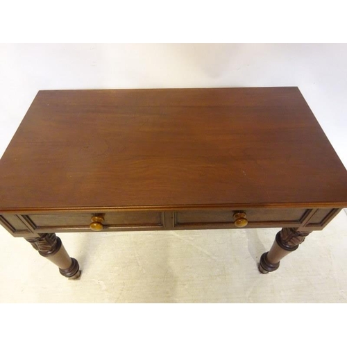 68 - Antique mahogany side or hall table fitted with two drawers and raised on turned legs with carved de... 