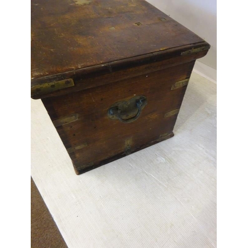 69 - Antique brass banded timber storage box with carrying handles. W. 97cm, D. 53cm, H. 50cm approx.