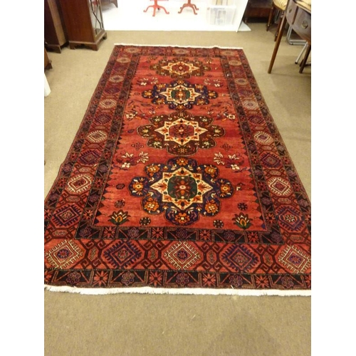 71 - Large oriental rug. 310cm x 160cm approx.