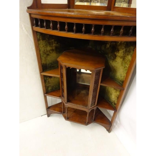 73 - A nicely carved late Victorian mahogany corner cabinet, the upper section with bevelled mirrors, the... 