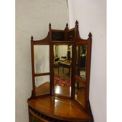 73 - A nicely carved late Victorian mahogany corner cabinet, the upper section with bevelled mirrors, the... 