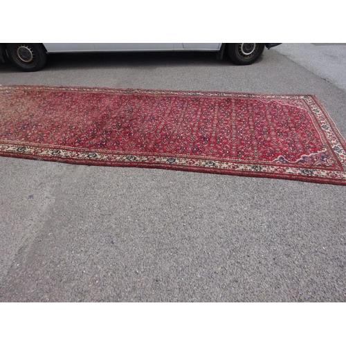 112 - Large old Eastern rug, some fading at one end. 520cm x 205cm.