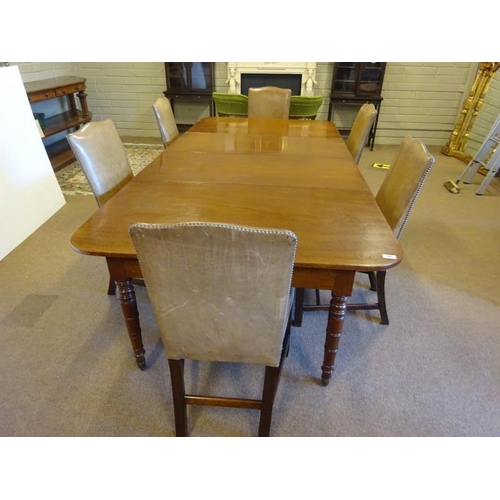 116 - An Irish Georgian mahogany dining room table having two extra leaves and raised on ring turned legs.... 