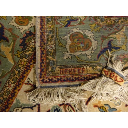 119 - A good Hereke Turkish rug having ivory field and all over design with Hereke inscription to one end.... 