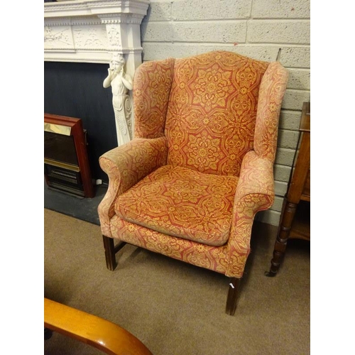 121 - Antique wing back drawing room chair raised on square legs with cross stretcher.