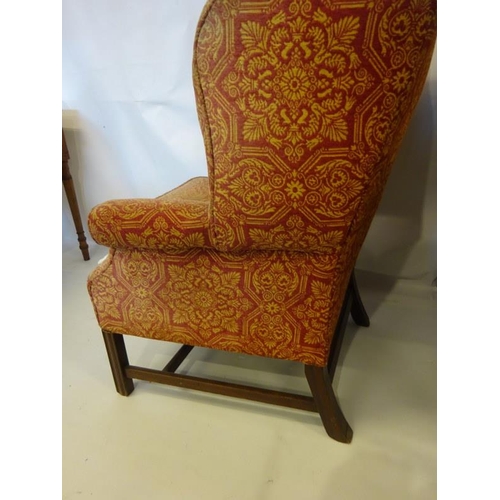 121 - Antique wing back drawing room chair raised on square legs with cross stretcher.