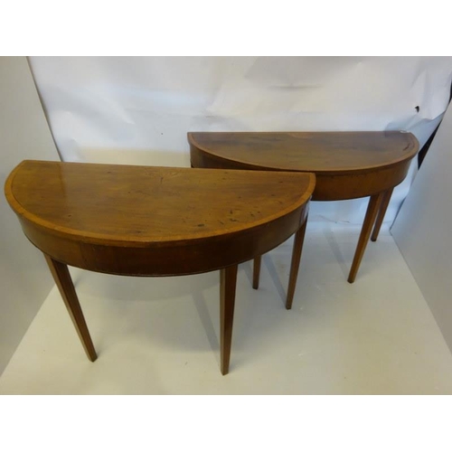 130 - Pair of Georgian Irish mahogany and satinwood banded demi lune side table raised on tapered legs. W.... 