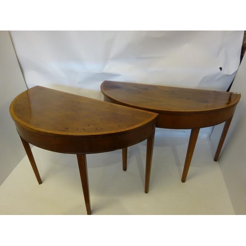 130 - Pair of Georgian Irish mahogany and satinwood banded demi lune side table raised on tapered legs. W.... 