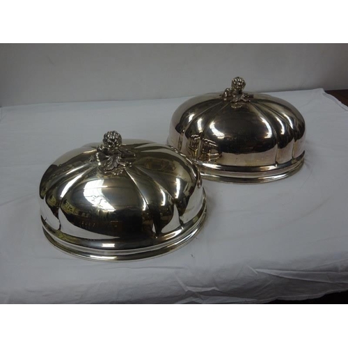 132 - Two good large silver plated dish covers.