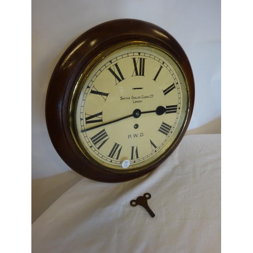 133 - Old Smiths railway clock with key. Diameter 34cm.