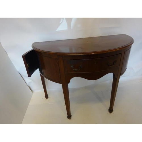 134 - Antique mahogany bow shaped sideboard fitted with a drawer and cupboards and raised on tapered legs.... 