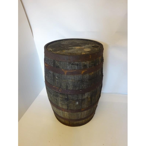 201 - Three timber and metal bound barrels. H. 90cm.