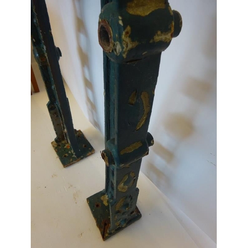 202 - A pair of heavy cast iron metal arch supports. H. 102cm.