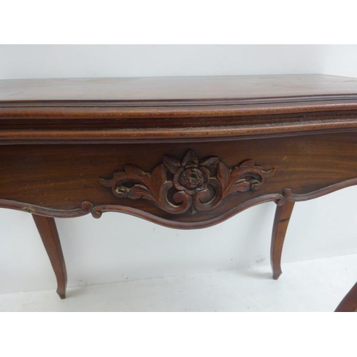 243 - Victorian mahogany card table, the shaped top over carved freize and raised on cabriole legs. W. 85c... 