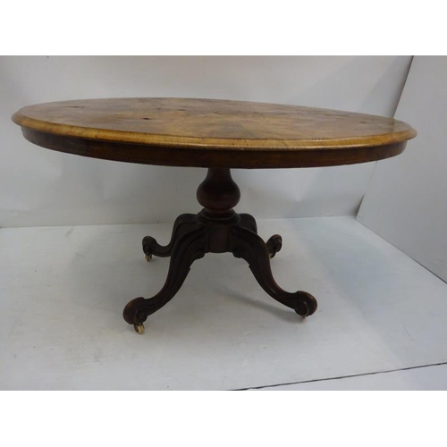 244 - Victorian figured walnut drawing room centre table on four shoot pod support. 134cm x 100cm approx.