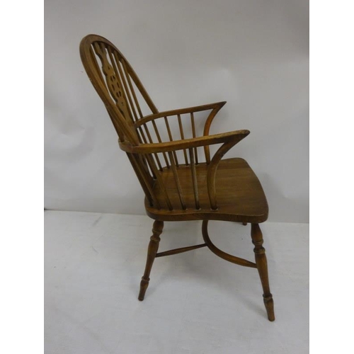 25 - An oak Windsor carver chair.