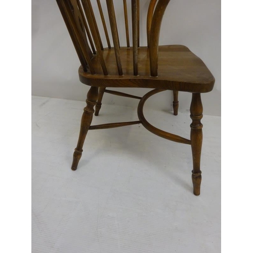 25 - An oak Windsor carver chair.