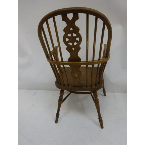 25 - An oak Windsor carver chair.