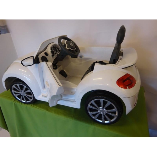 33 - A Volkwagen beetle convertible toy car with electric motor.