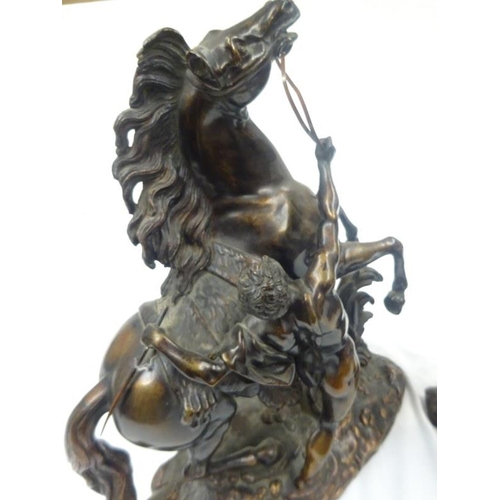 330 - A good pair of antique bronze marley horses with horsemen.