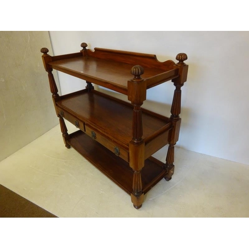 40 - Victorian mahogany three tier dumbwaiter fitted with two drawers and raised on fluted columns and fi... 