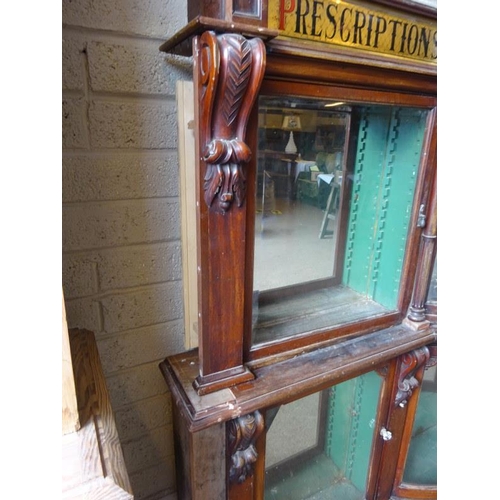 50 - Old Chemist shop cabinet as found. H. 174cm, D. 25cm, W. 240cm approx.  (Shelves missing)