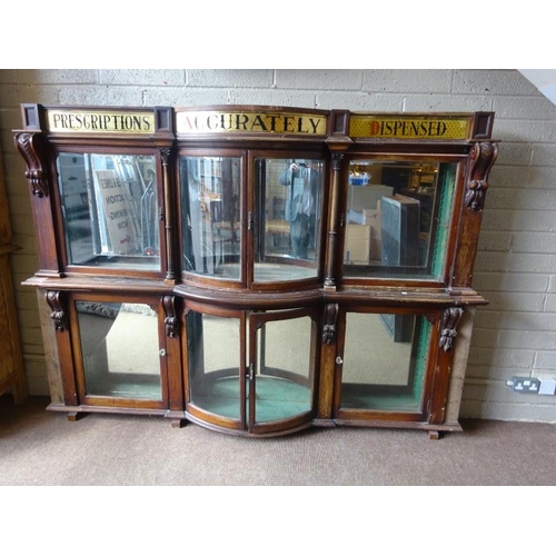 50 - Old Chemist shop cabinet as found. H. 174cm, D. 25cm, W. 240cm approx.  (Shelves missing)