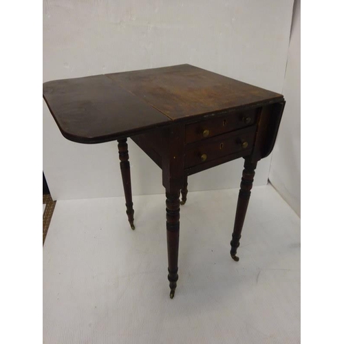 64 - Neat size antique mahogany drop leaf table fitted with real and dummy drawers and raised on ring tur... 