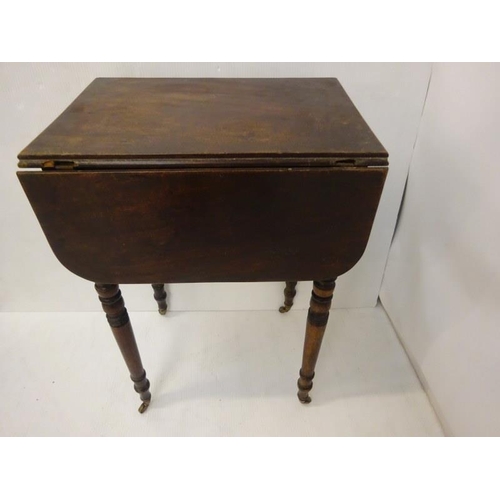 64 - Neat size antique mahogany drop leaf table fitted with real and dummy drawers and raised on ring tur... 