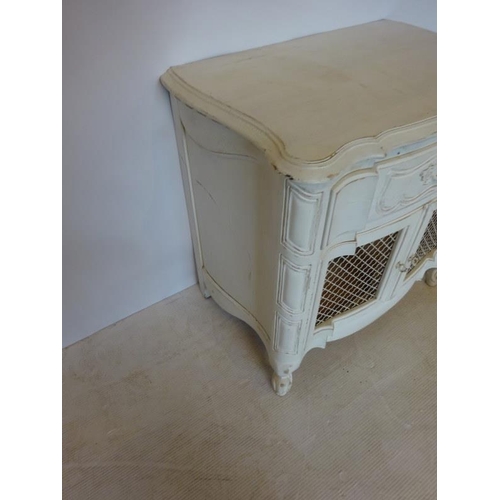 65 - A neat size vintage painted cabinet fitted with a drawer over cupboard doors with wire work panels. ... 