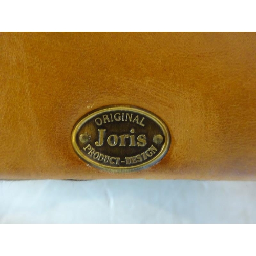 66 - Comfortable leather upholstered tub shaped easy chair with markers label on reverse.