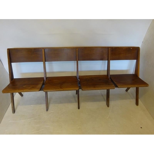 77 - An antique timber four seat folding bench. W. 190cm.