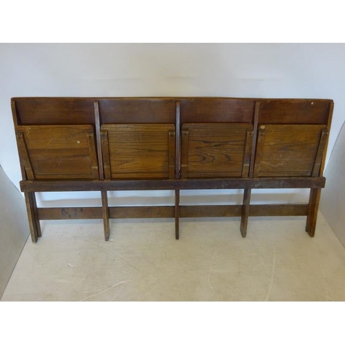 77 - An antique timber four seat folding bench. W. 190cm.