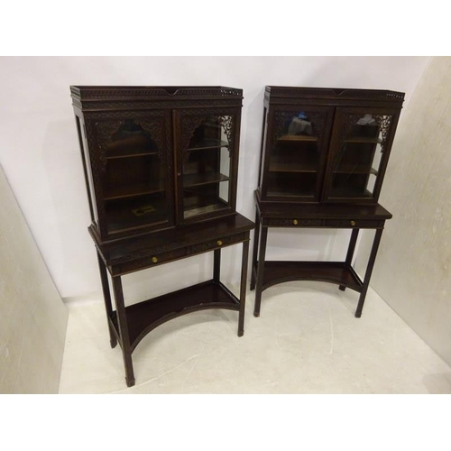 80 - A pair of Edwardian mahogany neat size drawing room cabinets, the upper section having decorative ti... 