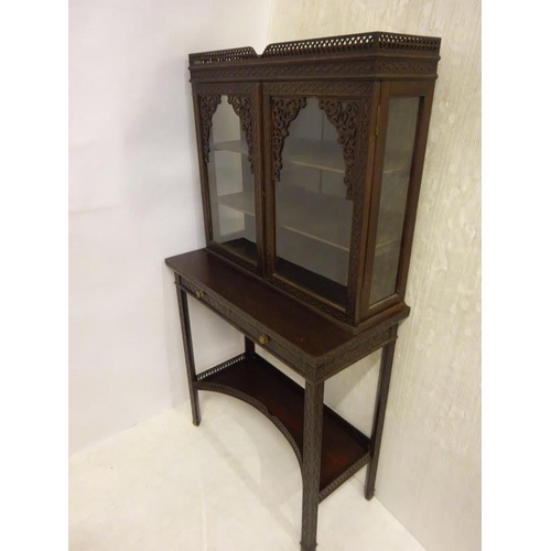 80 - A pair of Edwardian mahogany neat size drawing room cabinets, the upper section having decorative ti... 