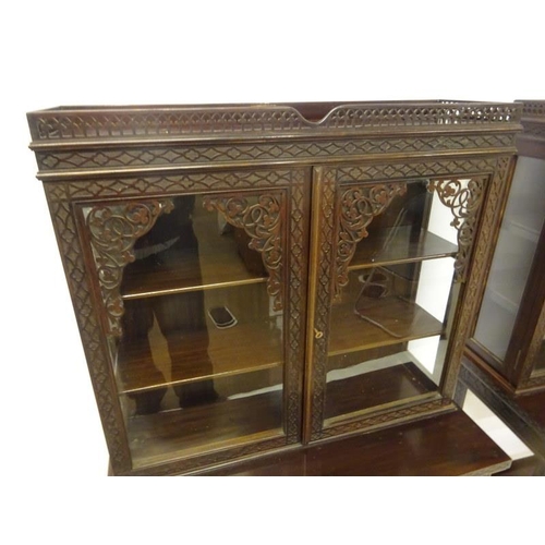 80 - A pair of Edwardian mahogany neat size drawing room cabinets, the upper section having decorative ti... 