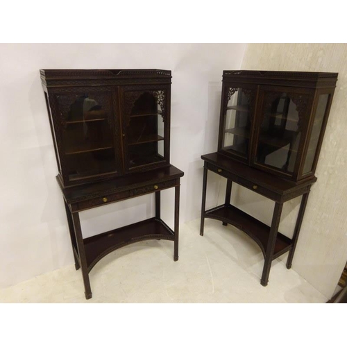 80 - A pair of Edwardian mahogany neat size drawing room cabinets, the upper section having decorative ti... 