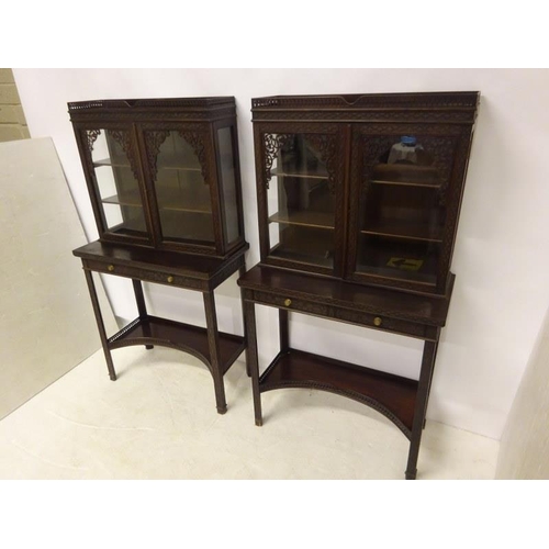 80 - A pair of Edwardian mahogany neat size drawing room cabinets, the upper section having decorative ti... 