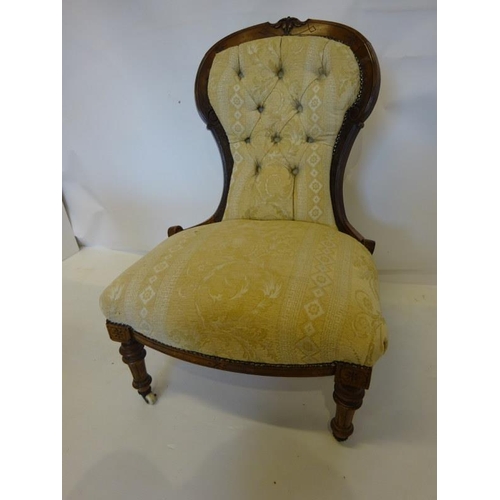 81 - Victorian walnut framed drawing room chair raised on turned legs.