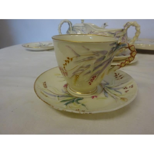 85 - A collection of early Belleek, 2 teapots, 1 teapot stand, 3 saucers, 2 cups and 1 side plate - all f... 