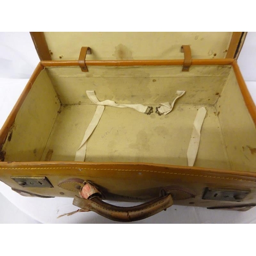 99 - Old leather suitcase with initials M. Mc. K.