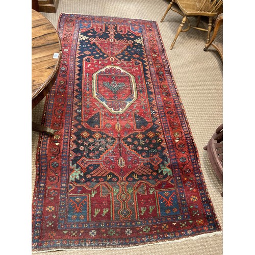 343 - Old Persian rug, centre worn. 276cm x 134cm.