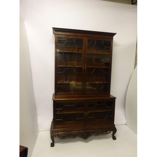 100 - An excellent quality Irish mahogany bookcase, the upper section having dental cornice over sectioned... 