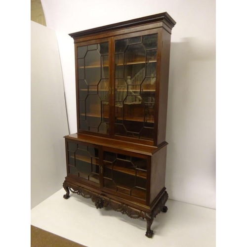 100 - An excellent quality Irish mahogany bookcase, the upper section having dental cornice over sectioned... 