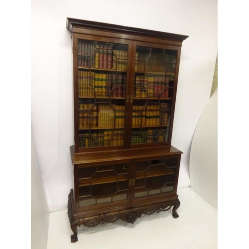 100 - An excellent quality Irish mahogany bookcase, the upper section having dental cornice over sectioned... 