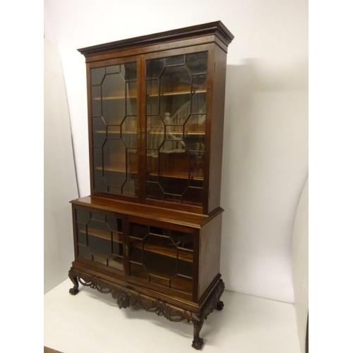 100 - An excellent quality Irish mahogany bookcase, the upper section having dental cornice over sectioned... 