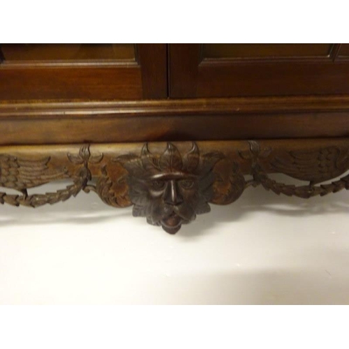 100 - An excellent quality Irish mahogany bookcase, the upper section having dental cornice over sectioned... 